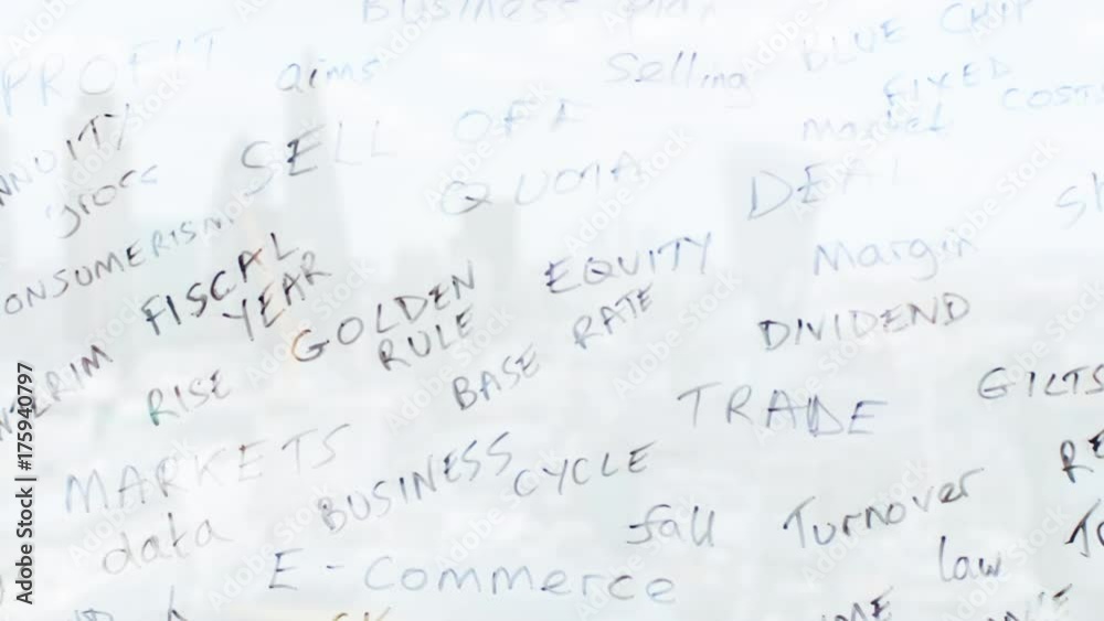 Reflection of a businessman writing business words onto glass Reflection of a businessman writing business words onto glass