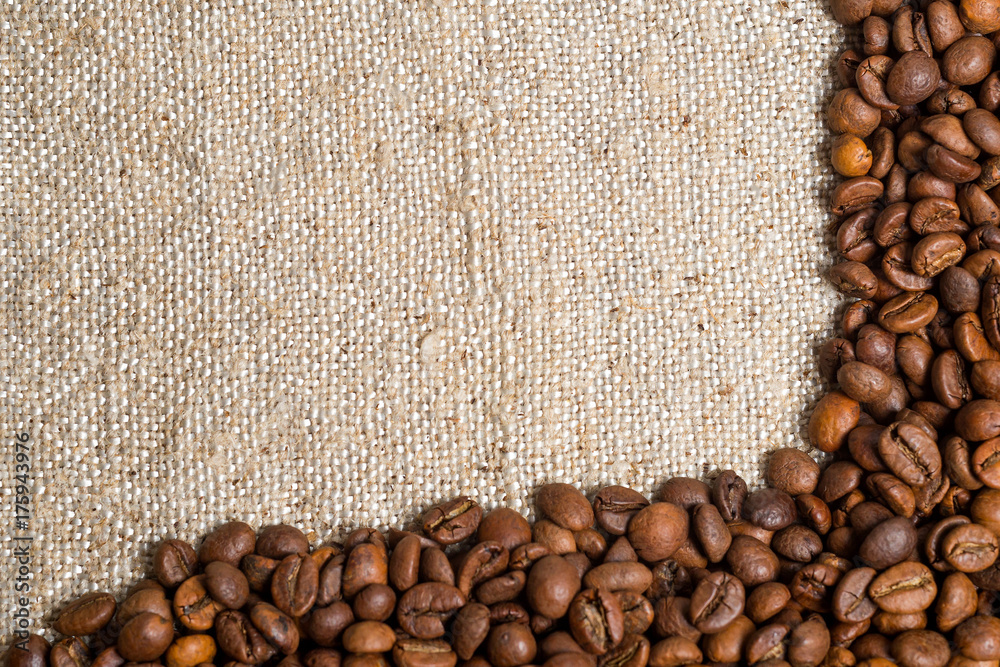 Spilled grains of fragrant coffee close-up. Photo frame, background. Spilled grains of fragrant coffee close-up. Photo frame, background.