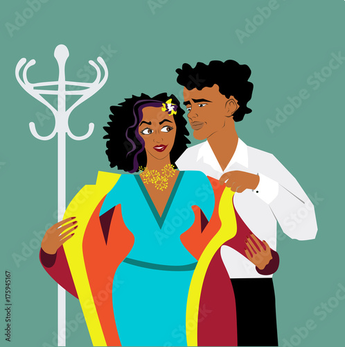 man putting coat on his girlfriend.good manners.etiquette.african couple.blue background and hanger