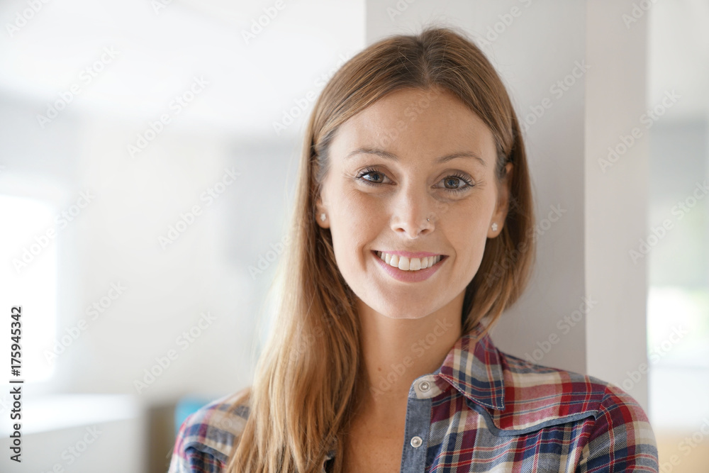 Portrait of smiling brunette girl looking at camera Portrait of smiling brunette girl looking at camera