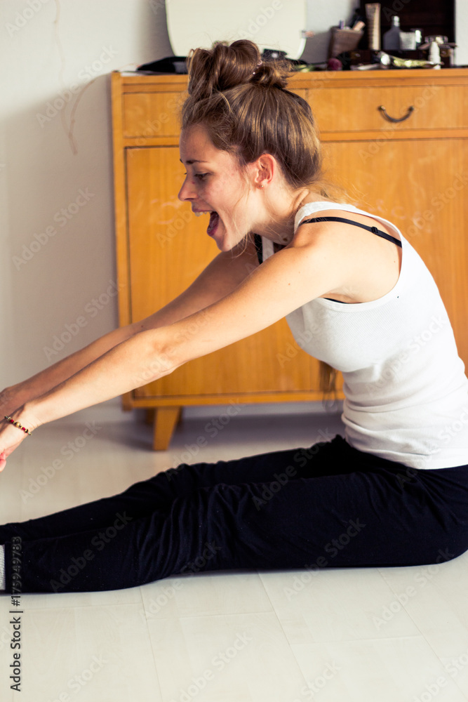 young woman doing gymnastics at home young woman doing gymnastics at home
