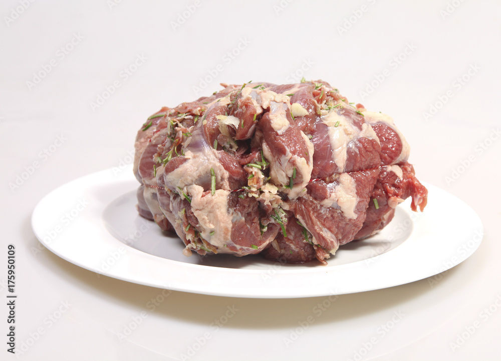 Plate with big piece of stuffed lamb