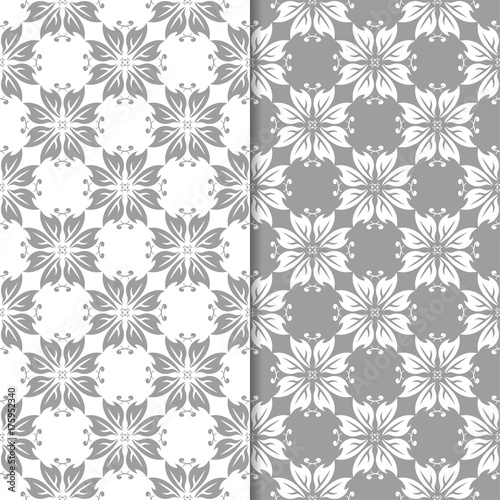 White and gray set of floral backgrounds. Seamless patterns