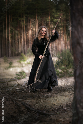 Halloween. beautiful girl witches in the woods with pumpkins © mak_alexandra