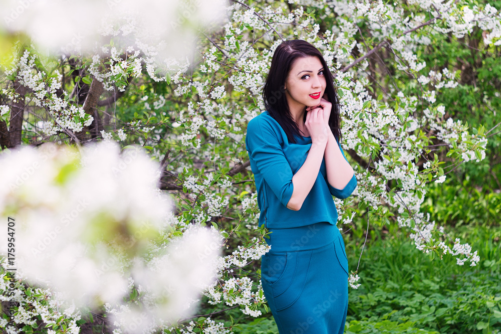 Young beautiful woman in spring blossoming garden Young beautiful woman in spring blossoming garden