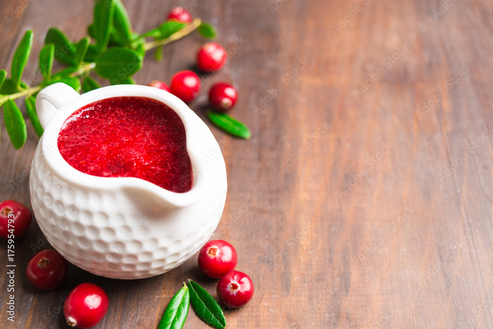 Red cranberry sauce in white saucepan for thanksgiving day Red cranberry sauce in white saucepan for thanksgiving day