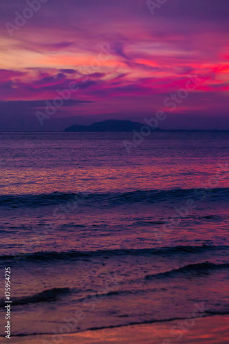 Purple sunset in Sanya, Hainan, China. Colorful madness from the clouds, merging with the sea.