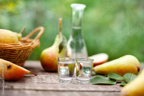 Shot glass with fresh pear liqueur