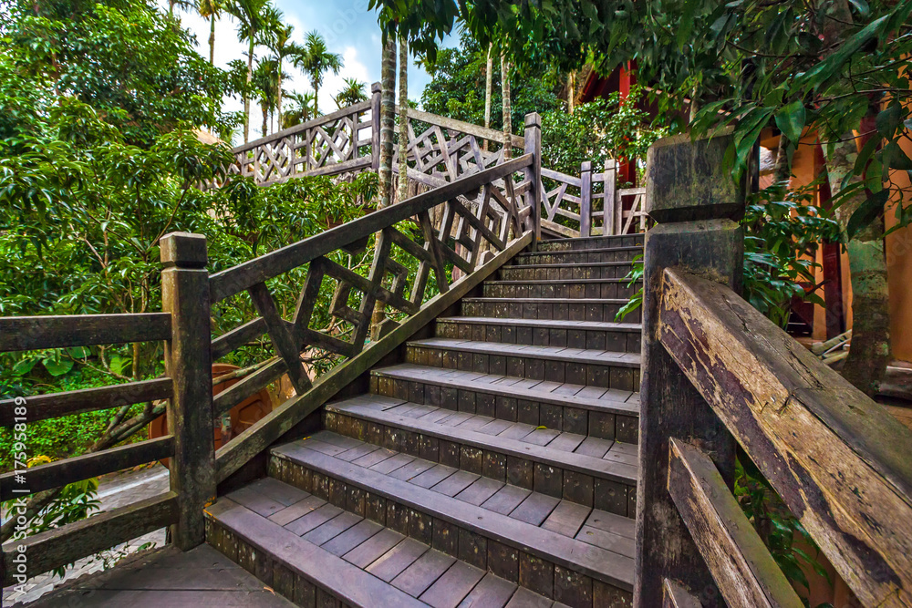 Wooden staircase to the bridge. Sanya Li and Miao Village. Hainan, China.