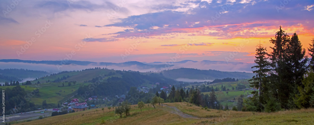 Panoramic view of sunrise in the mountains at Carpathian, Ukraine. 