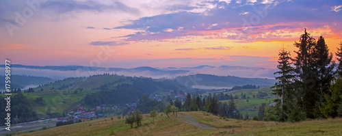 Panoramic view of sunrise in the mountains at Carpathian  Ukraine. 