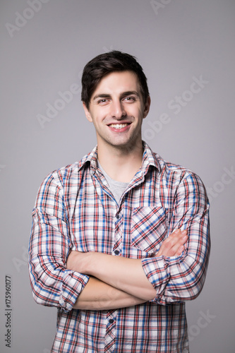 Wallpaper Mural Elegant handsome young handsome man with crossed hands in shirt. Torontodigital.ca
