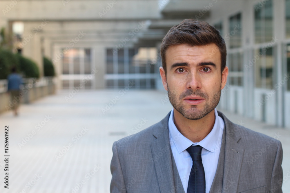 Perplexed businessman in office space Perplexed businessman in office space