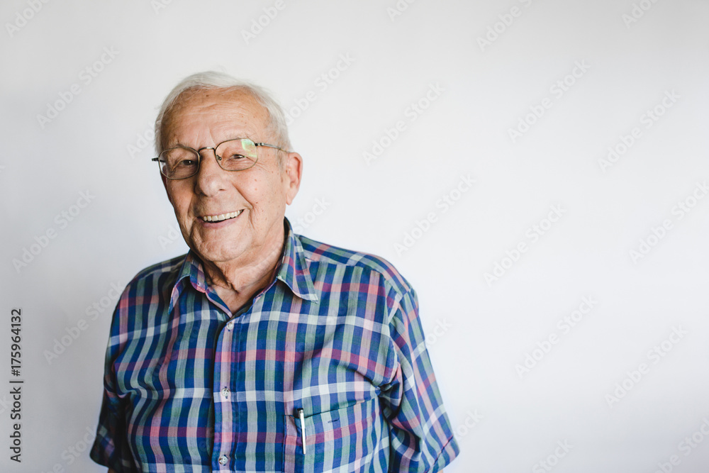 Happy senior man looking at camera on white background Happy senior man looking at camera on white background