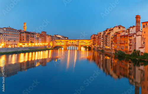 Panorama of River Arno and famous bridge Ponte Vecchio at night from Ponte Santa Trinita in Florence, Tuscany, Italy © Kavalenkava