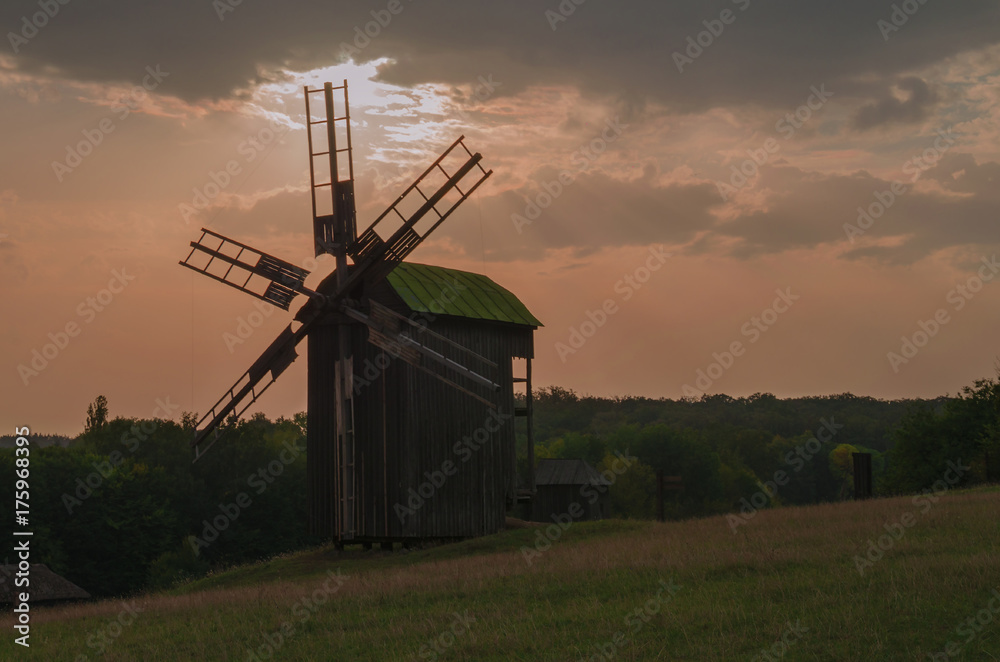 Fototapeta premium old mill on the sky background