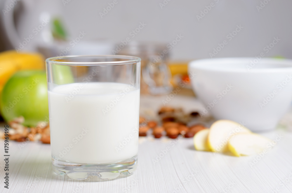 Healthy Breakfast. Milk in a glass. Fruit, nuts