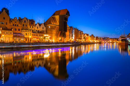 Gdansk at night with historic port crane reflected in Motlawa river  Poland