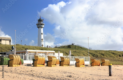 Lighthouse and beach in Egmond aan Zee. North Sea, the Netherlands. photo