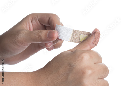 plaster on her injured finger on white background