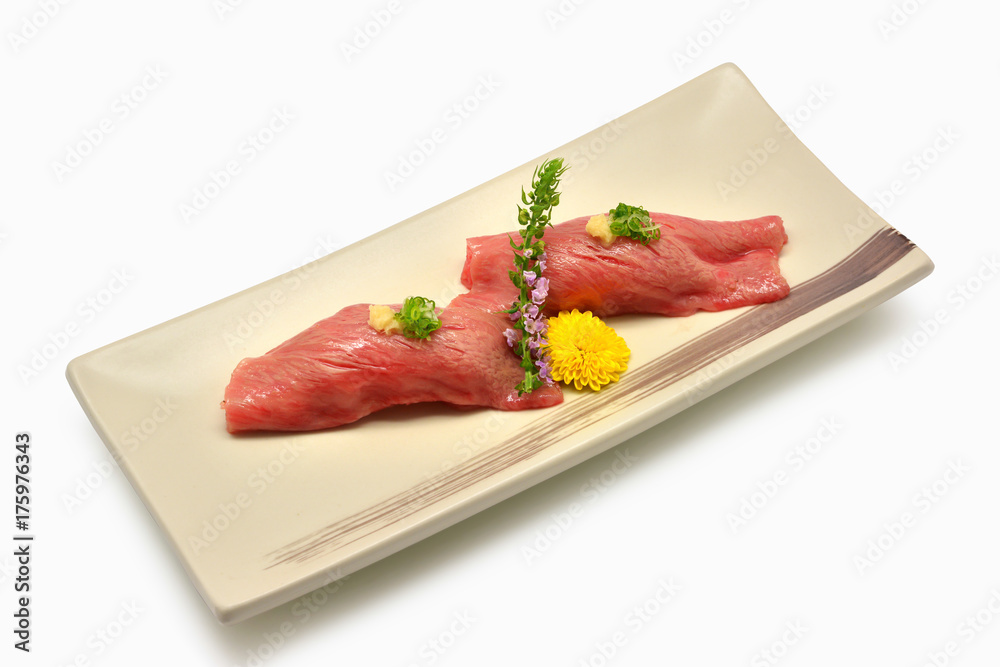 Sushi wagyu on plates Japanese style on whtie background. Japanese food Sushi wagyu on plates Japanese style on whtie background. Japanese food