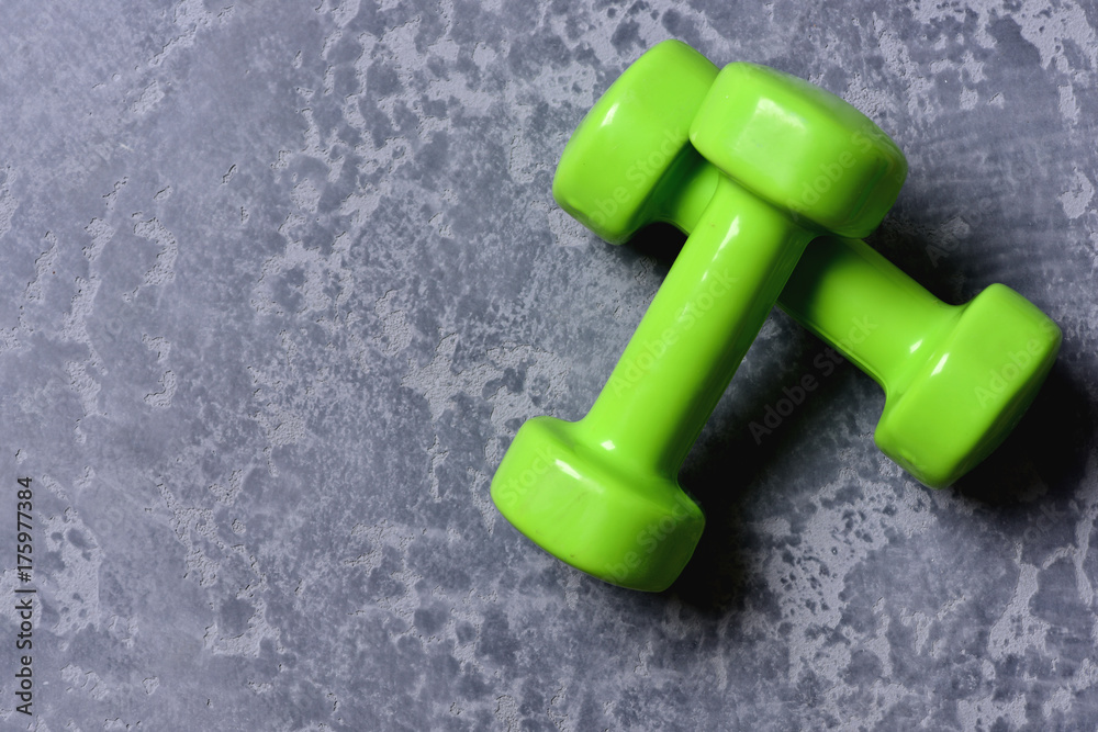 Shaping and fitness equipment. Pair of barbells placed crosswise. Shaping and fitness equipment. Pair of barbells placed crosswise.