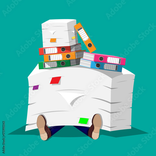 Businessman in pile of office papers