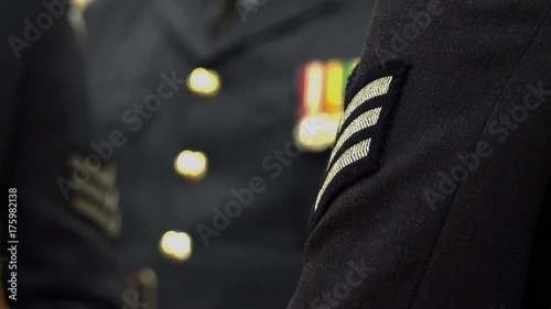 The blue uniform of the Royal Air Force showing medals and stripes.
