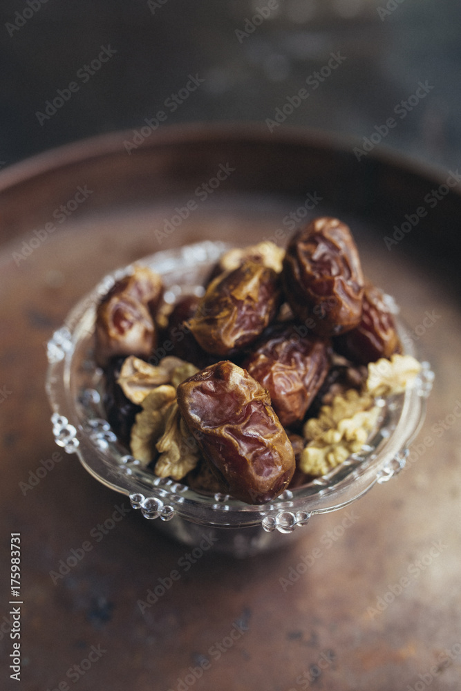 Date palm on a brown saucer Date palm on a brown saucer