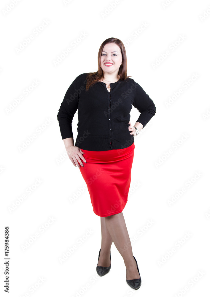 Fototapeta premium elegant chubby girl in office style stands in full growth isolated on white background