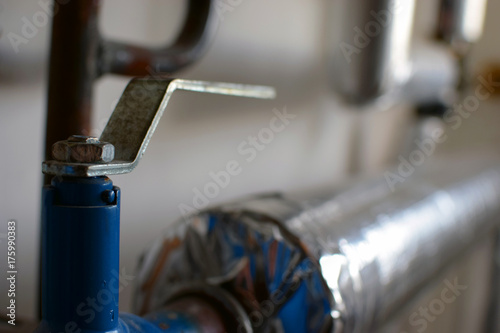 Close up of pipe and valve in heating system 