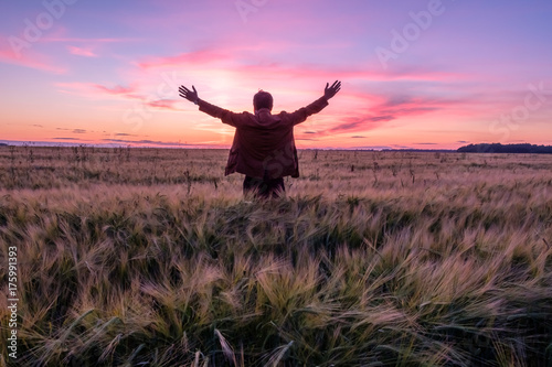 summer field at sunset of the day, people feel freedom raises