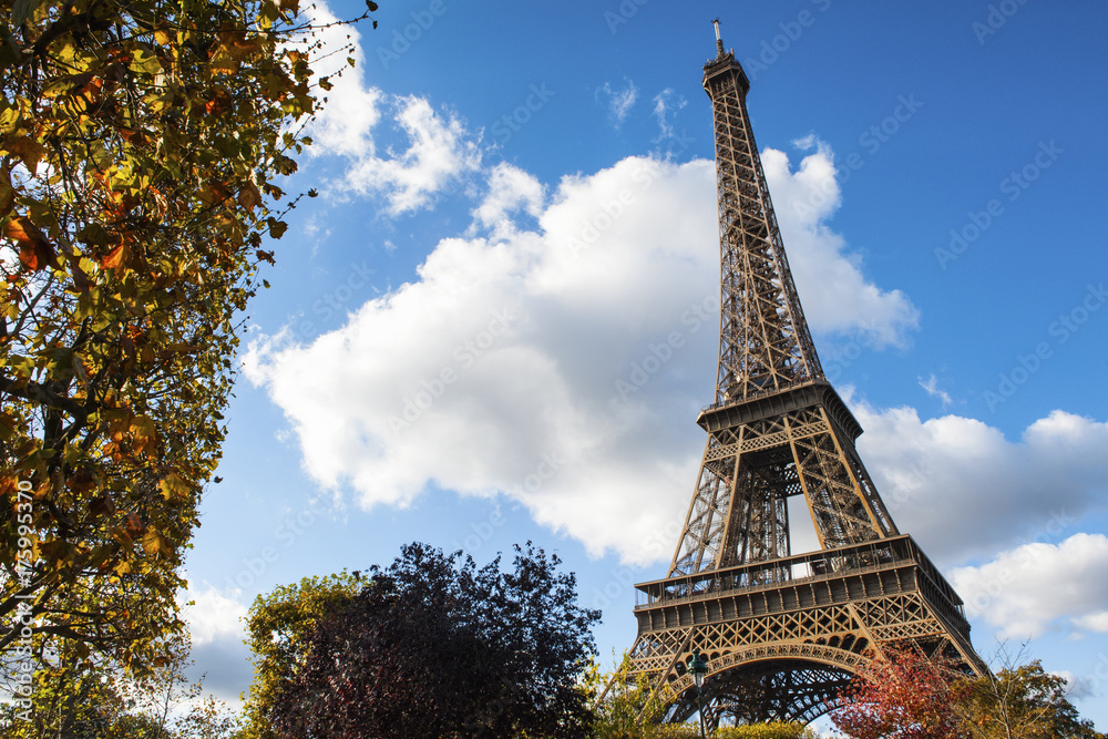 A view of the Eiffel tower with autumn colors, on a sunny day in November 2016 on Paris, France.