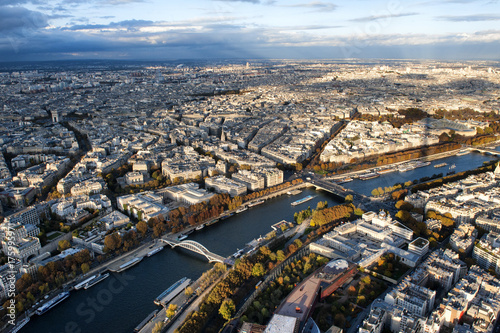 A wonderful view of Seine river and urban landscape with shadow of Eiffel tower at sunset in November 2016 in Paris.