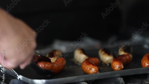flipping sausages in pan 