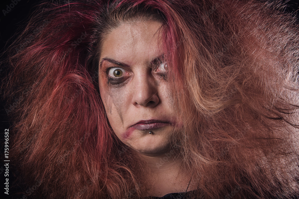 Crazy horror witch making scary faces, mad and deranged Crazy horror witch making scary faces, mad and deranged