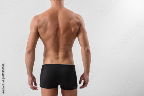Rear view of attractive naked guy