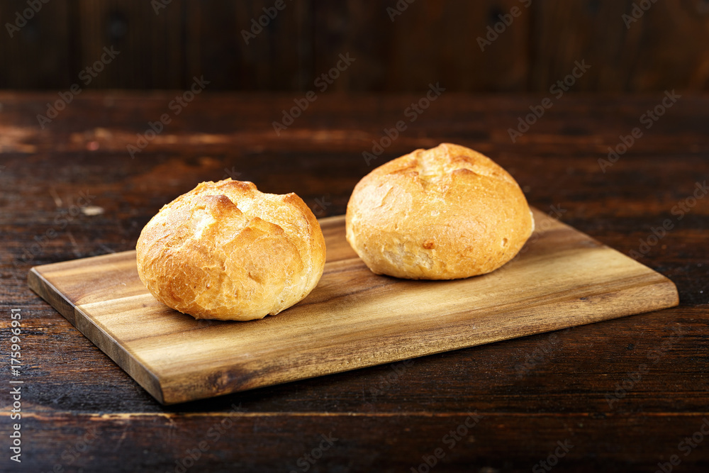 wheat buns on a wooden background