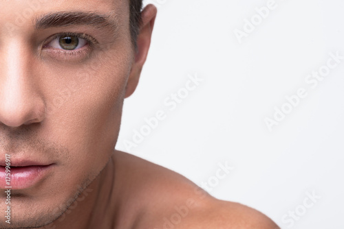 Attractive youthful man is expressing confidence