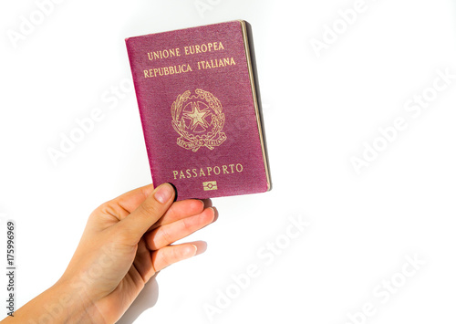 Woman's hand holding an Italian passport isolated - European Union