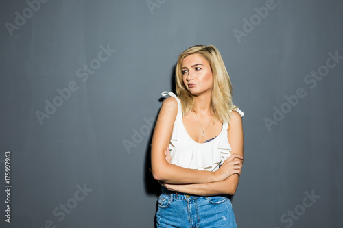 Portrait Of Beautiful Young Blond Woman on gray © F8  \ Suport Ukraine