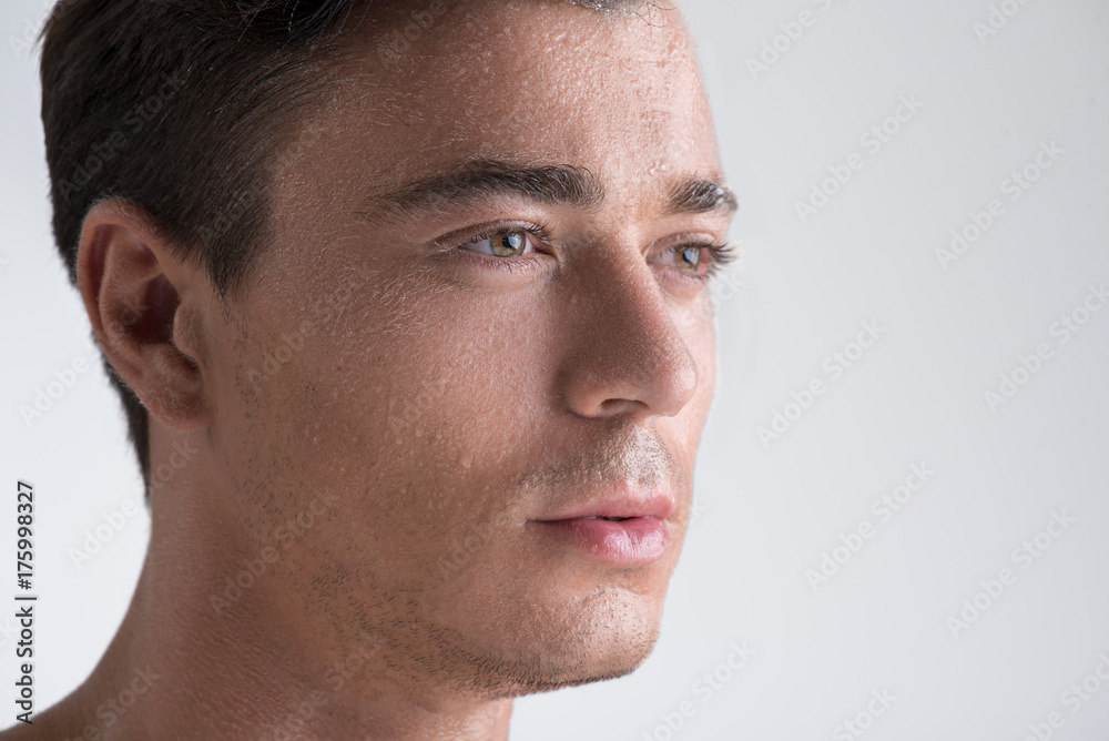 Pleasant serious man is viewing thoughtfully Pleasant serious man is viewing thoughtfully