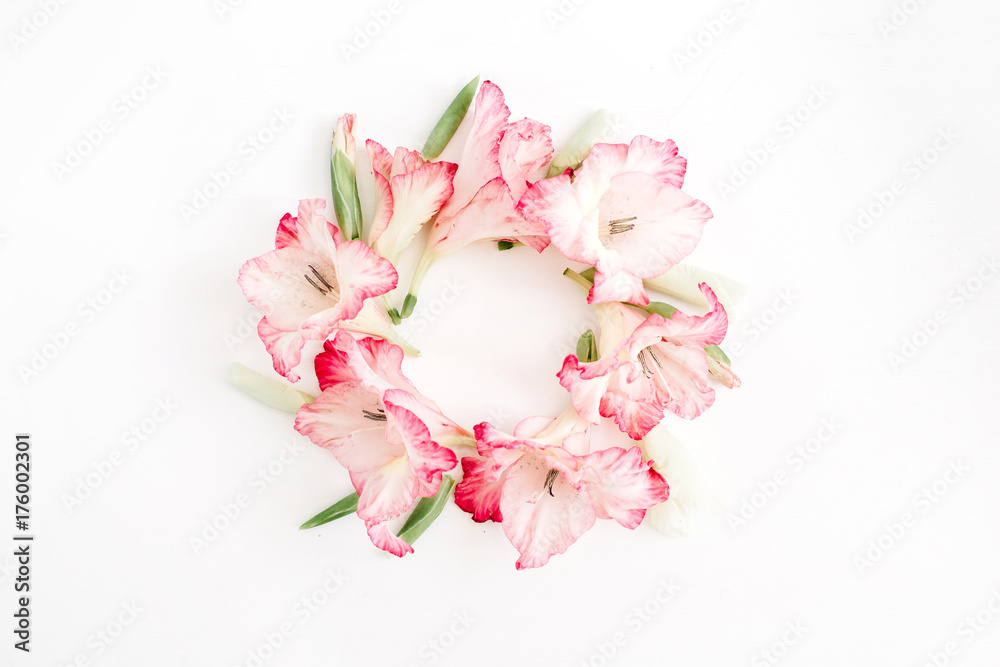 Beautiful pink gladiolus flower frame on white background. Flat lay, top view.