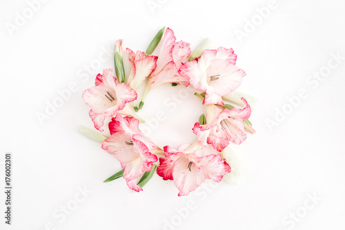 Fototapeta Naklejka Na Ścianę i Meble -  Beautiful pink gladiolus flower frame on white background. Flat lay, top view.