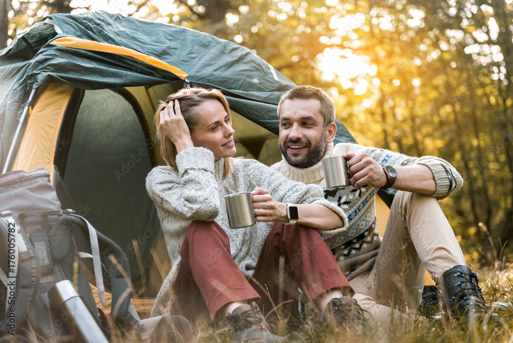 Cheerful loving couple spending great time in the nature