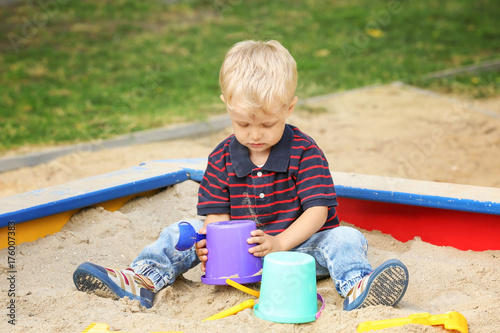 Cute little boy playing in ...