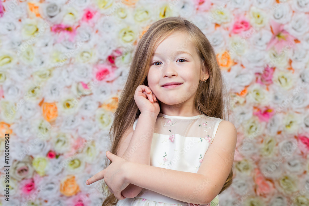 Portrait of little girl on floral background Portrait of little girl on floral background
