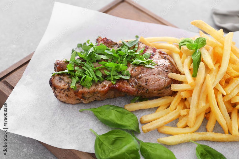 Delicious grilled steak frites on waxed paper