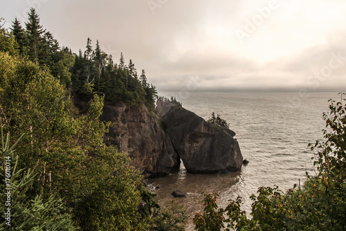 Sunrise famous Hopewell Rocks geologigal formations at low tide biggest tidal wave Fundy Bay New Brunswick Canada