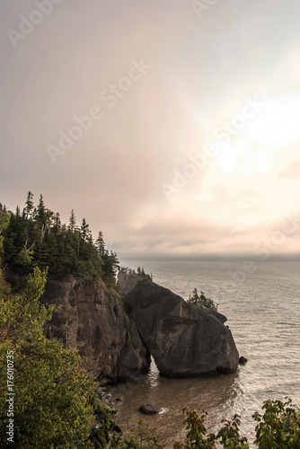 Sunrise famous Hopewell Rocks geologigal formations at low tide biggest tidal wave Fundy Bay New Brunswick Canada